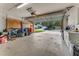 Spacious garage with storage cabinets, plenty of room for cars, and organization for equipment at 916 Ashmeade Ct, Port Orange, FL 32127
