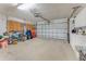 Spacious garage with storage cabinets, bicycles, and overhead door opener ready for your vehicles and gear at 916 Ashmeade Ct, Port Orange, FL 32127
