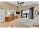 Cozy bedroom with a large window, wooden furniture, and soft lighting at 916 Ashmeade Ct, Port Orange, FL 32127