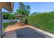 Outdoor patio with decorative pavers, garden hedge, and a seating area at 916 Ashmeade Ct, Port Orange, FL 32127