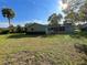 View of the rear of the home with a spacious backyard at 11027 Sw 75Th Ave, Ocala, FL 34476