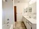 Bathroom features tile flooring, vanity with mirror, and bathtub at 11027 Sw 75Th Ave, Ocala, FL 34476