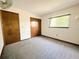 Bedroom with neutral carpet, closet, ceiling fan, and lots of natural light at 11027 Sw 75Th Ave, Ocala, FL 34476