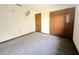 Bedroom featuring a neutral carpet, fan, and wooden closet at 11027 Sw 75Th Ave, Ocala, FL 34476