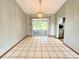 Bright dining area with tile floors and sliding glass doors leading to the lanai at 11027 Sw 75Th Ave, Ocala, FL 34476