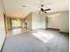Open-concept living area with a ceiling fan and views of the dining room and kitchen at 11027 Sw 75Th Ave, Ocala, FL 34476