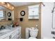 Neutral bathroom featuring a marble countertop vanity, white cabinets, and updated shower fixtures for a modern feel at 487 Midway Dr # B, Ocala, FL 34472