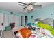 This bedroom features a ceiling fan, queen bed, clutter, and two large closets at 487 Midway Dr # B, Ocala, FL 34472