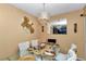 Dining room with glass table, six chairs, chandelier, and large mirror on the wall at 487 Midway Dr # B, Ocala, FL 34472