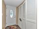Bright entryway featuring closet and decorative glass door at 487 Midway Dr # B, Ocala, FL 34472