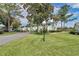 Scenic view of condos surrounded by lush greenery and mature trees at 487 Midway Dr # B, Ocala, FL 34472