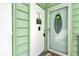 Close up of condo front door with sidelight window and decorative touches at 487 Midway Dr # B, Ocala, FL 34472