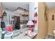 Bright kitchen featuring granite countertops, stainless steel refrigerator, and modern lighting at 487 Midway Dr # B, Ocala, FL 34472