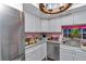Well-lit kitchen featuring stainless steel appliances and updated cabinetry, perfect for culinary enthusiasts at 487 Midway Dr # B, Ocala, FL 34472