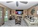 Inviting living room with fireplace, ceiling fan, and sliding doors allowing for natural light and comfortable living space at 487 Midway Dr # B, Ocala, FL 34472