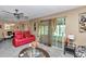 Bright living area showcasing comfortable seating, a sliding glass door, and stylish décor creating a relaxing atmosphere at 487 Midway Dr # B, Ocala, FL 34472
