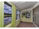 Enclosed sun room with water views, and sliding door at 487 Midway Dr # B, Ocala, FL 34472