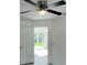 Bedroom with a ceiling fan and sliding glass doors leading to backyard at 15433 Sw 47Th Avenue Rd, Ocala, FL 34473