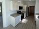 The kitchen has granite counters, stainless appliances, and white cabinets at 15433 Sw 47Th Avenue Rd, Ocala, FL 34473