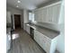 Modern kitchen featuring granite countertops, stainless steel appliances, and white cabinets at 15433 Sw 47Th Avenue Rd, Ocala, FL 34473