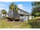 Exterior view of townhouses with a fenced yard, bench and manicured bushes at 4426 Sw 49Th Ave, Ocala, FL 34474