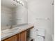 A well-lit bathroom featuring a single vanity, a large mirror, and a tub/shower combo at 4426 Sw 49Th Ave, Ocala, FL 34474