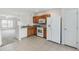 Functional kitchen with white appliances and a tile floor, seamlessly connecting to the adjacent living space at 4426 Sw 49Th Ave, Ocala, FL 34474