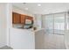 Efficient kitchen featuring white appliances, and a convenient layout with access to outdoor patio at 4426 Sw 49Th Ave, Ocala, FL 34474