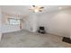Bright and airy living room featuring neutral carpet and an open layout, perfect for entertaining at 4426 Sw 49Th Ave, Ocala, FL 34474