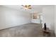 Open-concept living room with neutral carpet and seamless flow into the adjacent kitchen area at 4426 Sw 49Th Ave, Ocala, FL 34474