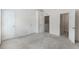 An airy primary bedroom featuring plush carpeting and multiple closets at 4426 Sw 49Th Ave, Ocala, FL 34474