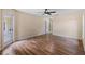 Large bedroom with wood flooring, ceiling fan and access to a patio at 9879 Sw 38Th Ave, Ocala, FL 34476