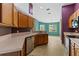 The kitchen offers lots of wooden cabinet storage and stainless-steel appliances at 9879 Sw 38Th Ave, Ocala, FL 34476