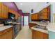 Spacious kitchen featuring stainless steel appliances and plenty of cabinet space at 9879 Sw 38Th Ave, Ocala, FL 34476
