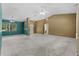 Expansive living room with high ceilings, neutral paint, large windows, and open access to other rooms at 9879 Sw 38Th Ave, Ocala, FL 34476