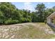 This property boasts a large vacant lot with lush green trees, offering privacy and potential for outdoor enjoyment at 9879 Sw 38Th Ave, Ocala, FL 34476