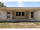 A covered patio features side entrances and a central window, offering a cozy outdoor space at 9879 Sw 38Th Ave, Ocala, FL 34476