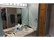 The bathroom has a closet and a shower area at 32932 Crooked Oaks Ln, Leesburg, FL 34748