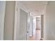 Hallway with wood-look flooring and white doors at 103 13Th Se St, Winter Haven, FL 33880
