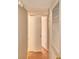 Hallway with wood-look flooring and white doors at 103 13Th Se St, Winter Haven, FL 33880