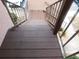 A downward view of a wooden staircase with metal railings leading to the ground level outside a building at 218 La Casa, Lake Wales, FL 33898