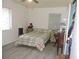 Cozy bedroom with neutral walls, updated floors, and bright natural light from two windows at 218 Steedly Ave, Lake Wales, FL 33853