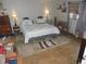 Tranquil bedroom with a patterned bedspread and matching bedside lamps at 218 Steedly Ave, Lake Wales, FL 33853