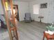 Cozy living room featuring chair, natural light, and hardwood floors at 218 Steedly Ave, Lake Wales, FL 33853