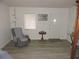 Inviting living room featuring chair, natural light, and neutral paint at 218 Steedly Ave, Lake Wales, FL 33853