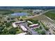 Aerial view of condos close to the lake featuring ample parking and lush landscaping at 220 La Casa # 220, Lake Wales, FL 33898