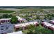 Aerial view of property featuring mature trees, ample parking, and well-maintained grounds at 220 La Casa # 220, Lake Wales, FL 33898