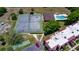 Overhead view showcasing the community pool, tennis court, and beautifully landscaped grounds at 220 La Casa # 220, Lake Wales, FL 33898