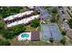 Scenic aerial view featuring well-maintained tennis courts and community condos at 220 La Casa # 220, Lake Wales, FL 33898