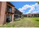 Backyard showing green space with patios and screened in lanai at 220 La Casa # 220, Lake Wales, FL 33898